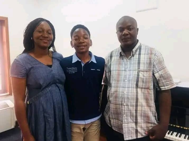 The Director with a student and his family