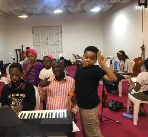 The Director with young keyboard students